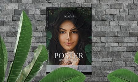 Free-Glued-Poster-on-Stone-Wall-Mockup-With-Leaves