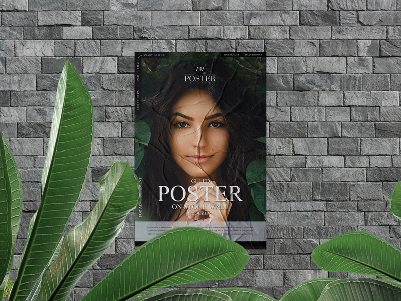 Free-Glued-Poster-on-Stone-Wall-Mockup-With-Leaves